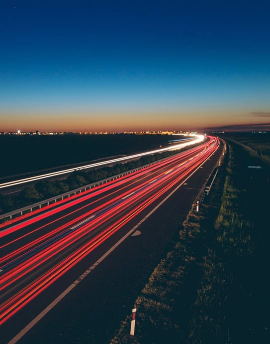 Beautiful view of transportation lights on the road at night time